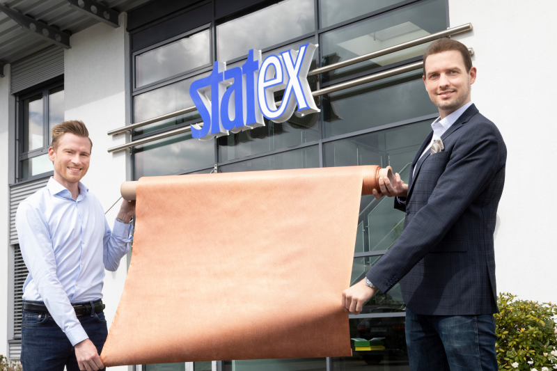 Milan Christiansen and Robert Erichsen of Bremen company Statex holding a roll of copper fleece.