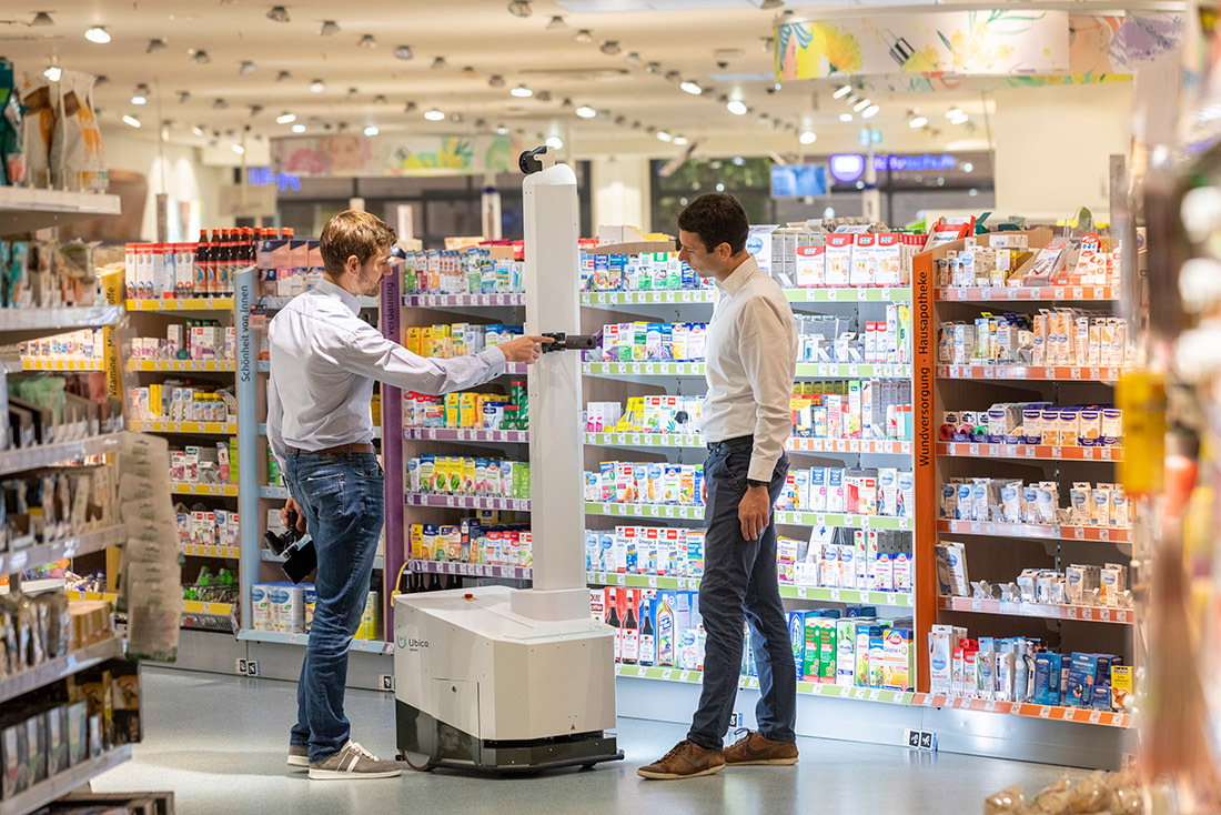 The managing directors of Ubica Robotics Georg Bartels (l.) and Jonas Reiling demonstrate their scanning robot in a branch of a drugstore chain in Bremen. The managing directors of Ubica Robotics Georg Bartels (l.) and Jonas Reiling demonstrate their scanning robot in a branch of a drugstore chain in Bremen.
