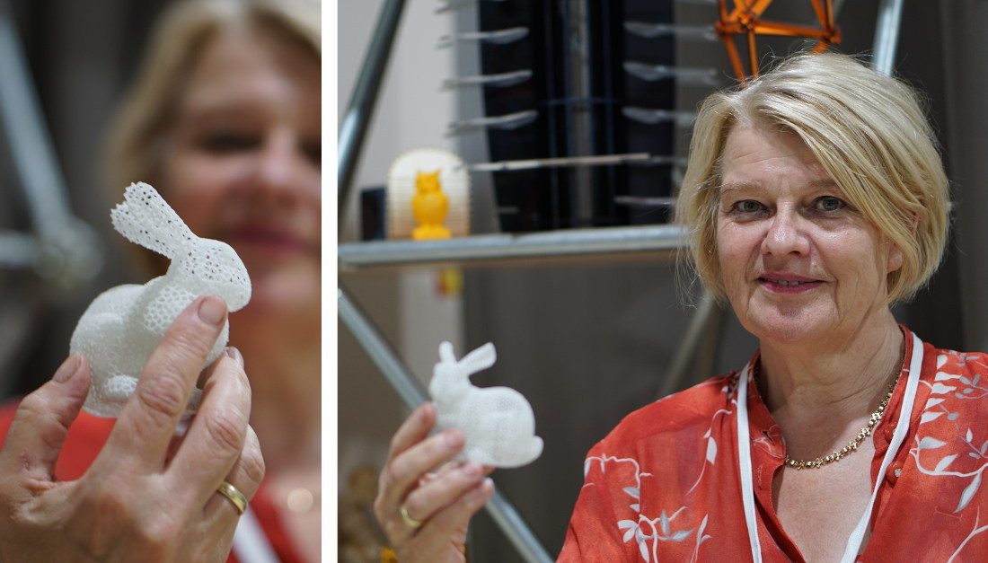 Antje Moebus holding an intricate, 3D-printed hare