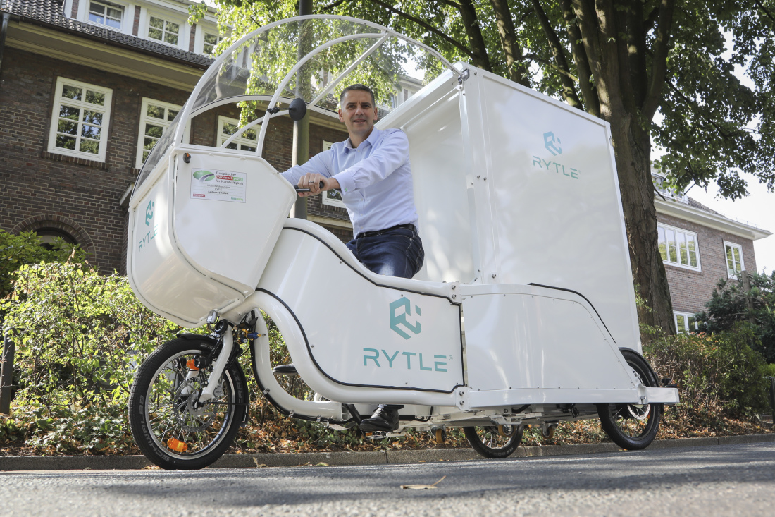 Dr. Arne Kruse, founder of RYTLE, demonstrates the "MovR" cargo bike