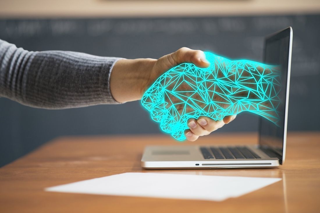 Hand in hand – robotic process automation (RPA) assists with routine office tasks Hand in hand – robotic process automation (RPA) assists with routine office tasks