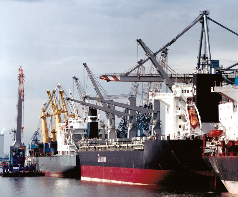 Seagoing vessels being unloaded in Neustadt port.