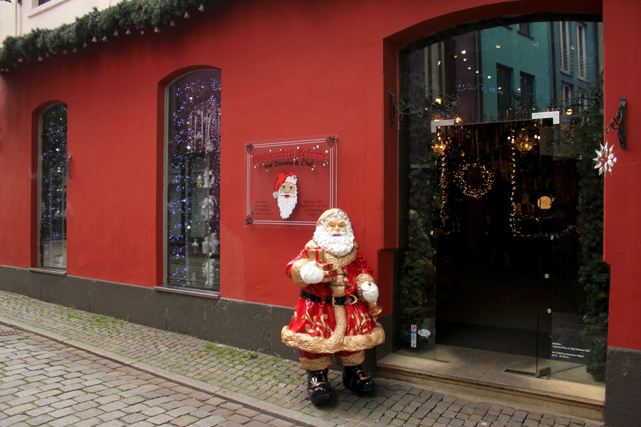 The entrance of the Christmas store with a Santa Claus