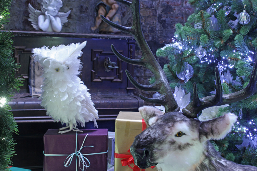 A snowy owl and a reindeer in the Christmas store